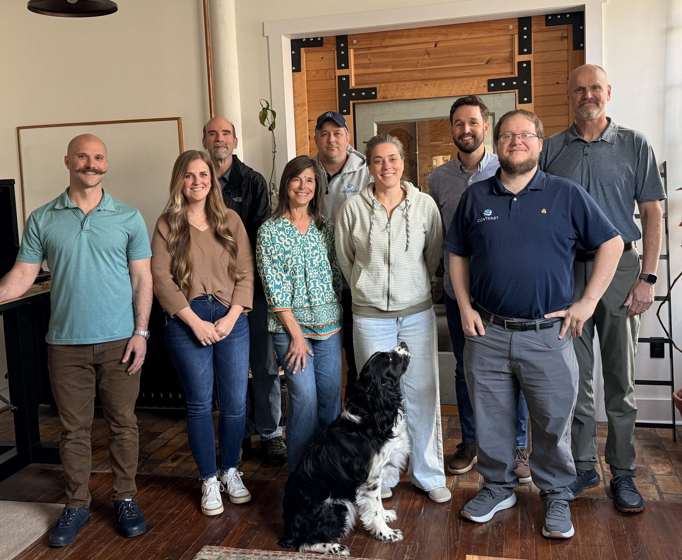 A photo of the contrast team and the office dog.